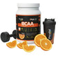 BCAA 2:1:1 Pro-vital sabor laranja de 500g com haltere e fatias de laranja, suplemento ideal para treinos de força.
