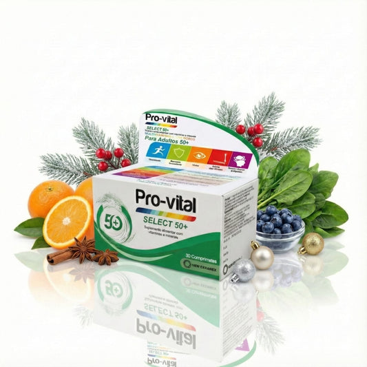 Embalagem de suplemento alimentar Pro-vital Select 50+ apresentada num cenário de Natal com decoração festiva, incluindo ramos de pinheiro, bolas prateadas e douradas, laranjas frescas, mirtilos e paus de canela.